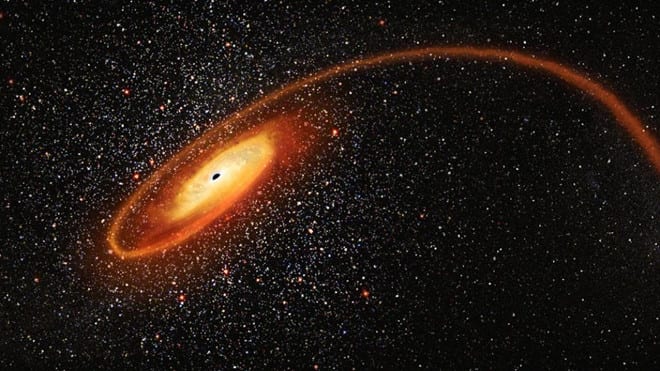 Hình ảnh mô phỏng hố đen vào thời điểm "xé xác" nạn nhân /// NASA/ESA